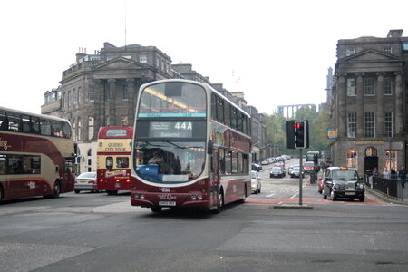 Red double decker on the streets photo