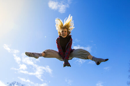 Young Girl Jumping High photo