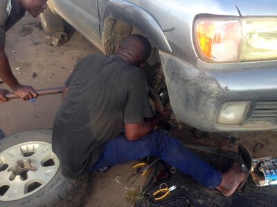 Mechanic grease monkey car photo