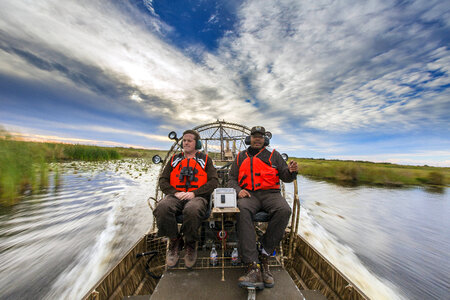 Employees maneauver an airboat at Bayou Sauvage NWR-4