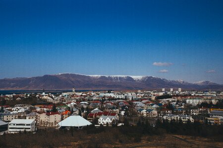 Aerial view of Reykjavik, Iceland with snow capped mountains photo