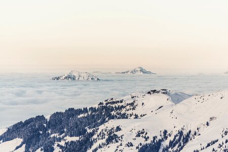 Winter mountains above the clouds photo