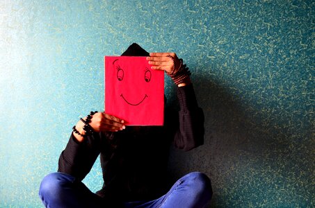 Smiley mask sitting photo