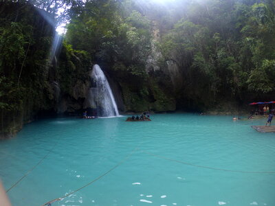 bamboo raft near waterfall enjoying stunning view. Kawasan falls photo