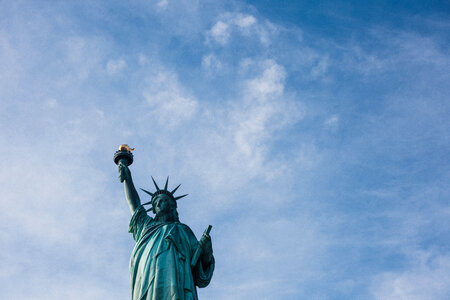 Statue of Liberty against Blue Sky photo