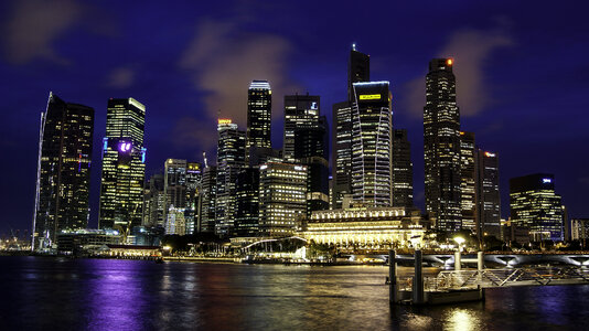 Singapore Skyline with dark blue sky in the background at night photo