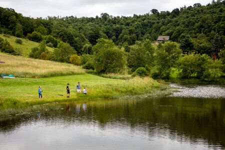 Adult with kids fishing photo