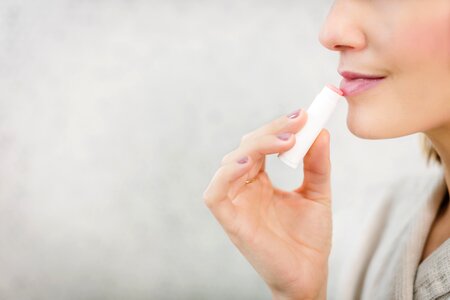 Woman Applying Lipstick photo