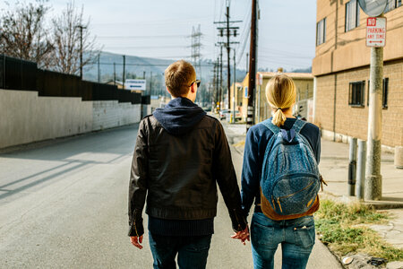 Couple Walking Holding Hands in an Urban Area photo