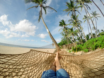 Lazy Time Man in a Hammock on the Beach photo