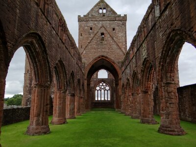 The Gothic ruins of Whitby Abbey with the suns rays