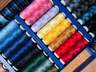 Colorful sew spools of thread