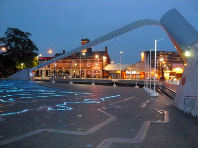 Millennium Square by night, showing the Time Zone Clock in Coventry, England photo