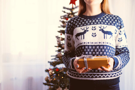 Woman with a gift. Merry Christmas photo