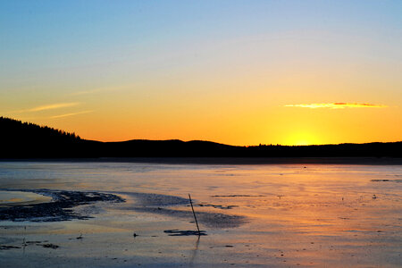 Sunset over the Frozen Lake photo