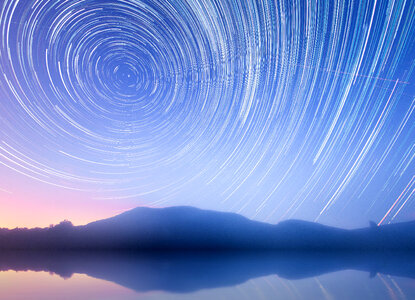Star Trails in the sky over the mountain and mountains photo