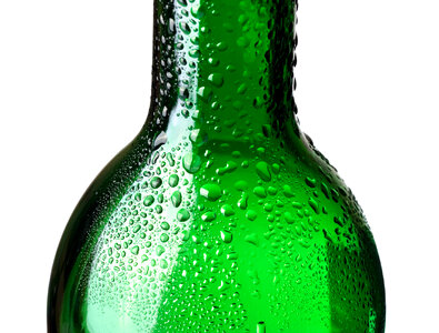 Closeup of green bottle with water drops photo