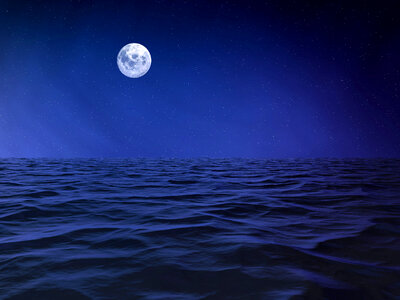 Moon over the ocean nightscape photo