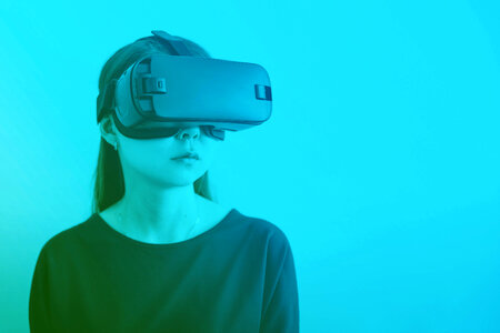 Woman wearing virtual reality goggles. photo