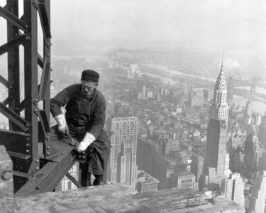 A construction worker on top of the Empire State Building as it was being built in 1930 in New York photo