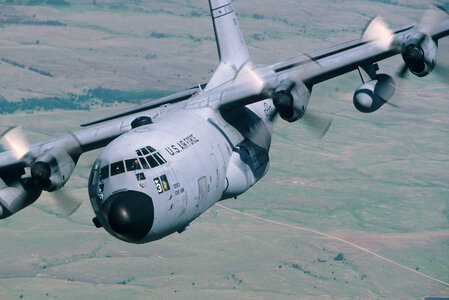 C-130 close up flying clear sky
