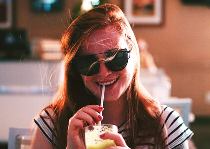 Young Woman Drinking Juice photo