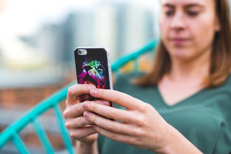 Woman Using Smart Phone With Case photo