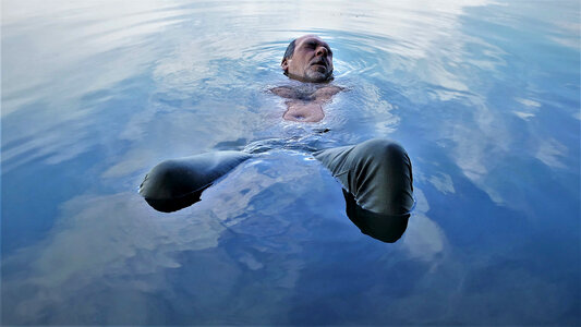 Man immersed in water photo