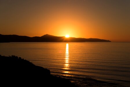 Sunrise on the sea mirroring morgenstimmung photo