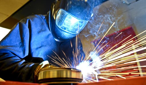 Welding and bright sparks. Hard job photo