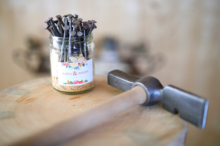 Hammer and nails on wood background