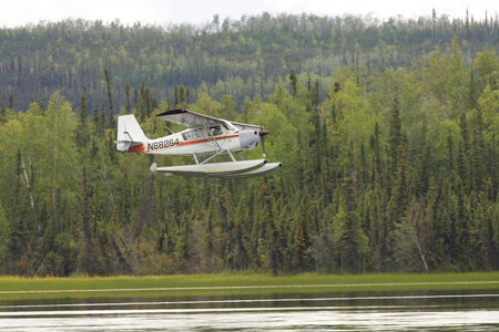 Seaplane flying over lake at Tetlin National Wildlife Refuge