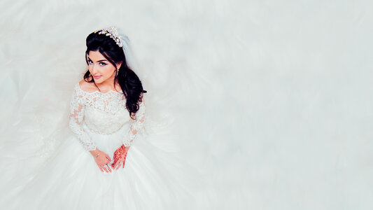 Beautiful Bride Dressed in White Dress Top View photo