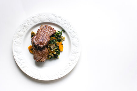 Top View of Beef Steak with Vegetables photo