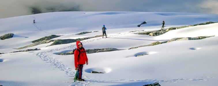 Hikers walk in snow mountain Pico Humbold