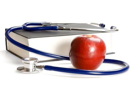 book, apple and stethoscope