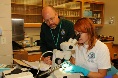 NCTC Fish ID instructor helps a student-2