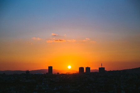 Sun Setting Over City photo