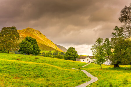 Pathway to house with hills landscape photo