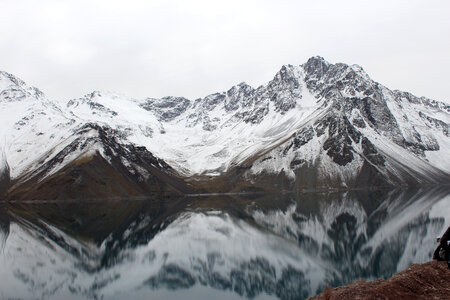 Mountains covered in snow with reflections and pond
