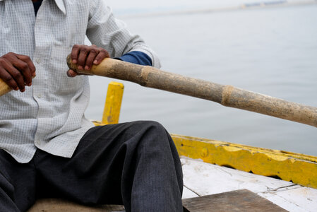 Man Rowing Boat in Ganges photo