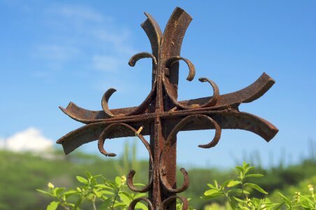 Easter image of rusty nail crosses with gold fabric photo