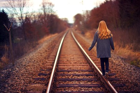 Girl Walking Railway Track photo