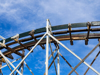 Wooden Rollercoaster Tracks Under Blue Sky photo