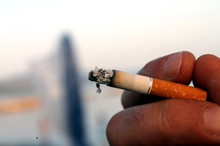 Smoke tobacco hand with cigarette