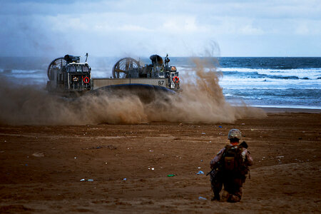 US Navy hovercraft carries vehicles and Marines