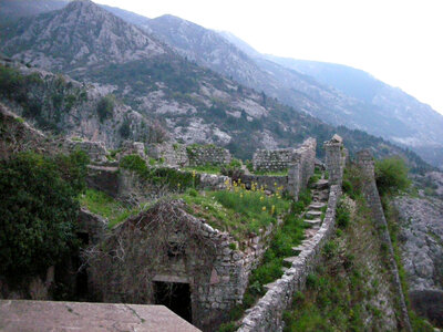 Stairs and mountainside stone buildings in Kotor, Montenegro photo