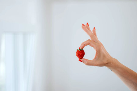 Woman Holding a Strawberry photo