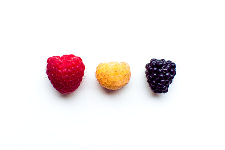 Colorful fresh berries on a white background photo