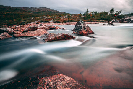 River rapids flowing towards the sea photo